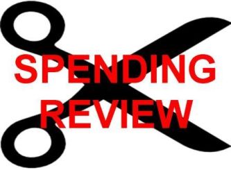 Realizzazione grafica con forbici e la scritta "spending review"